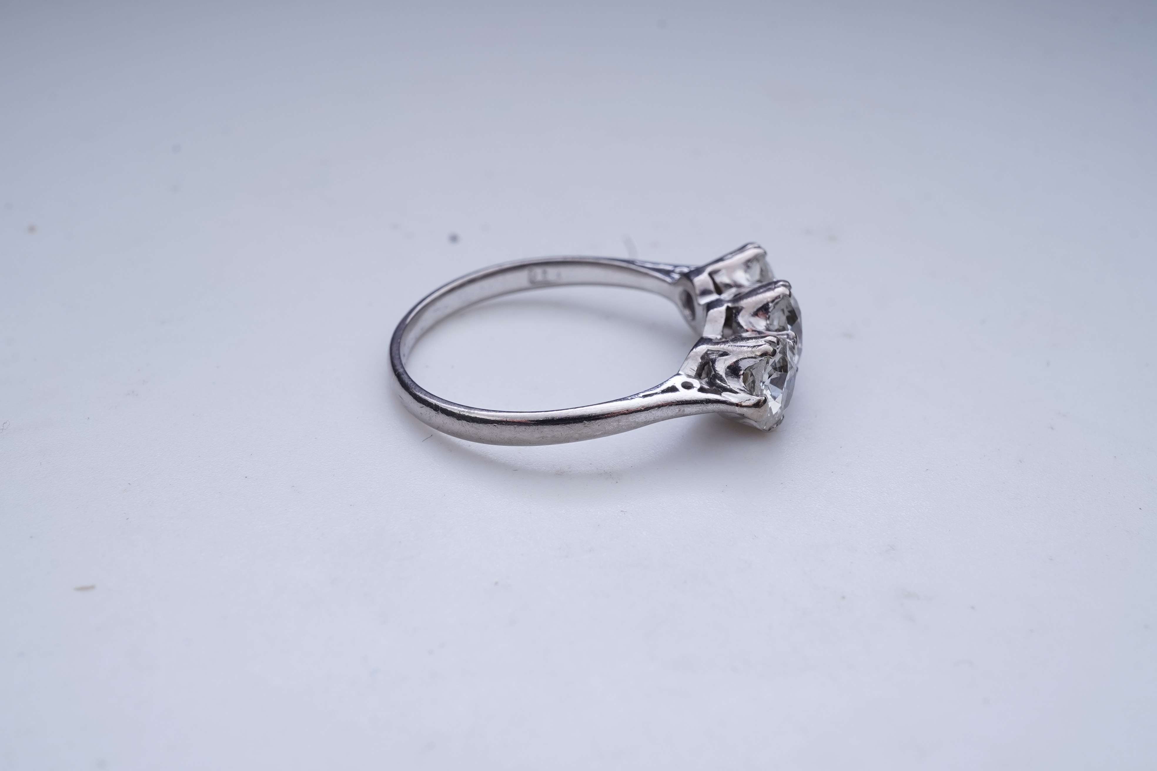A three-stone diamond ring, early 20th century